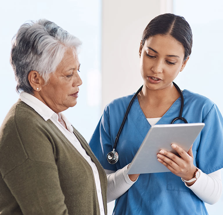 ABW Medical privia health centers nurse discussing paperwork with patient
